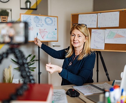 Teacher demonstrating on whiteboard