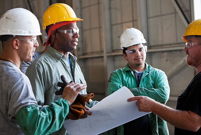 Construction workers discussing