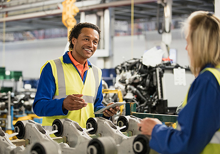 Two coworkers in a factory