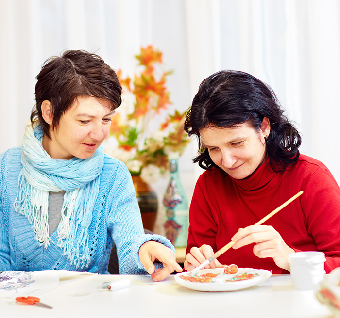 Two women working together