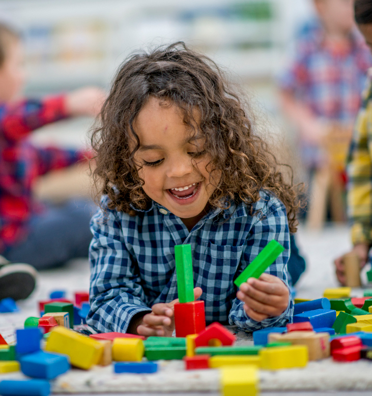 Child stacking blocks