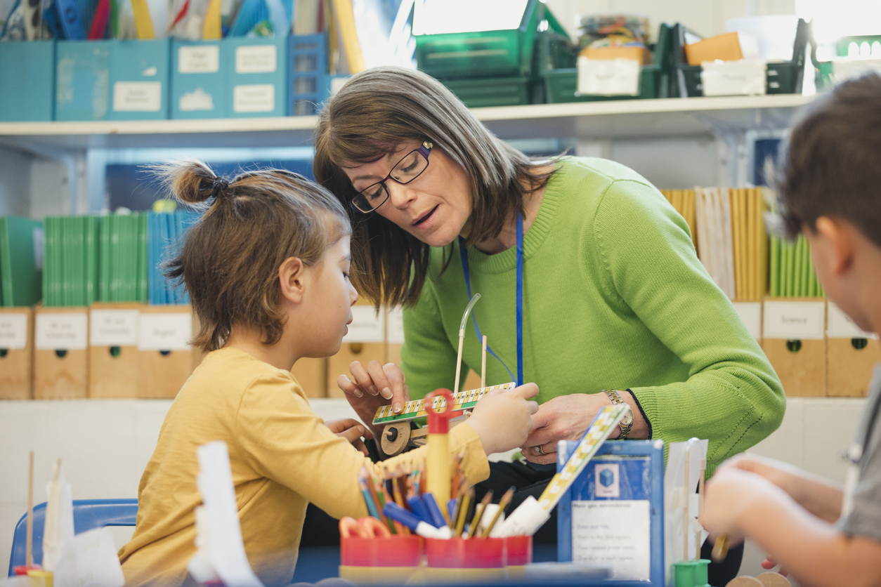 Teacher working directly with a child