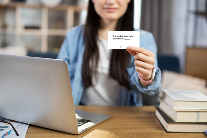 Person holding up flashcard