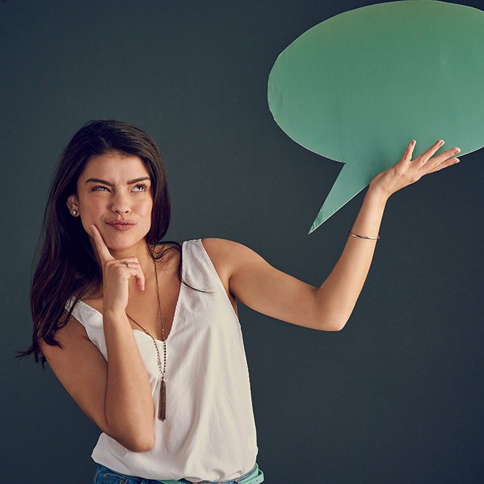 Woman Skeptical Holding Speech Bubble