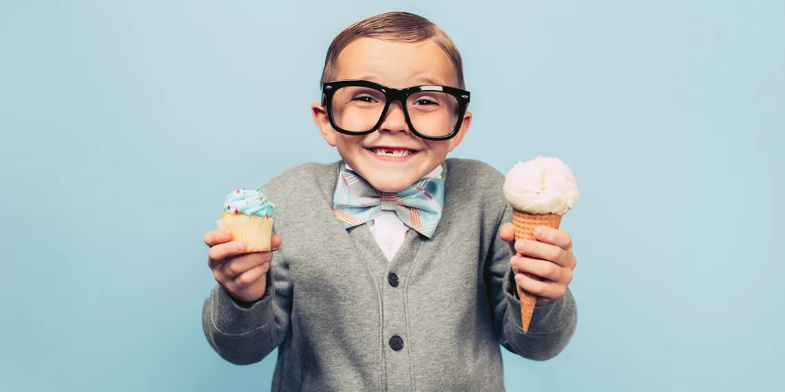 Boy with a cupcake and ice cream cone