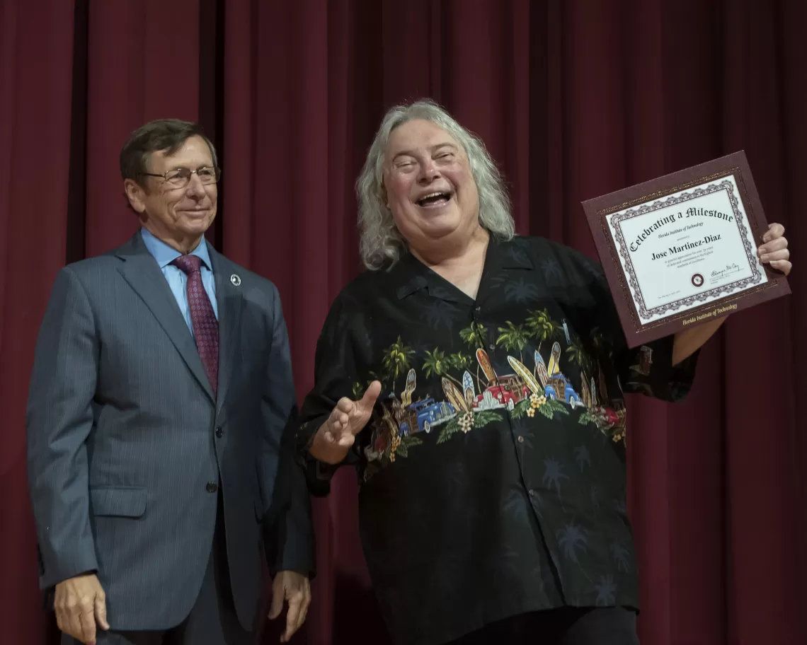 Dr Jose Martinez-Diaz receiving an award