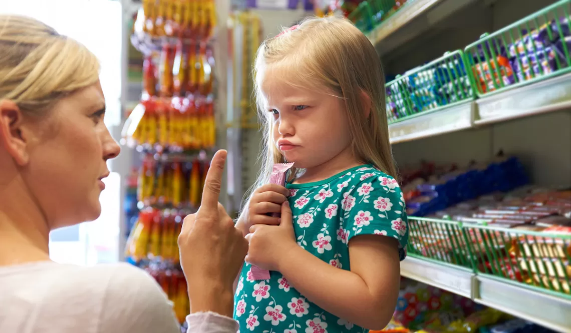 Woman Scolding Child in Store