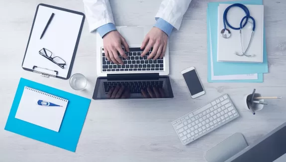 Medical office desk with laptop