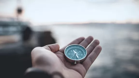 Sailor holding a compass