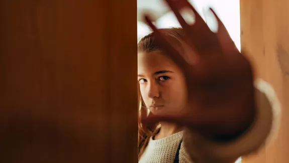 Girl holding stopping with hand