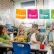 A teacher in a classroom with children doing various activities