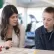 a teacher and a student going over work at a desk